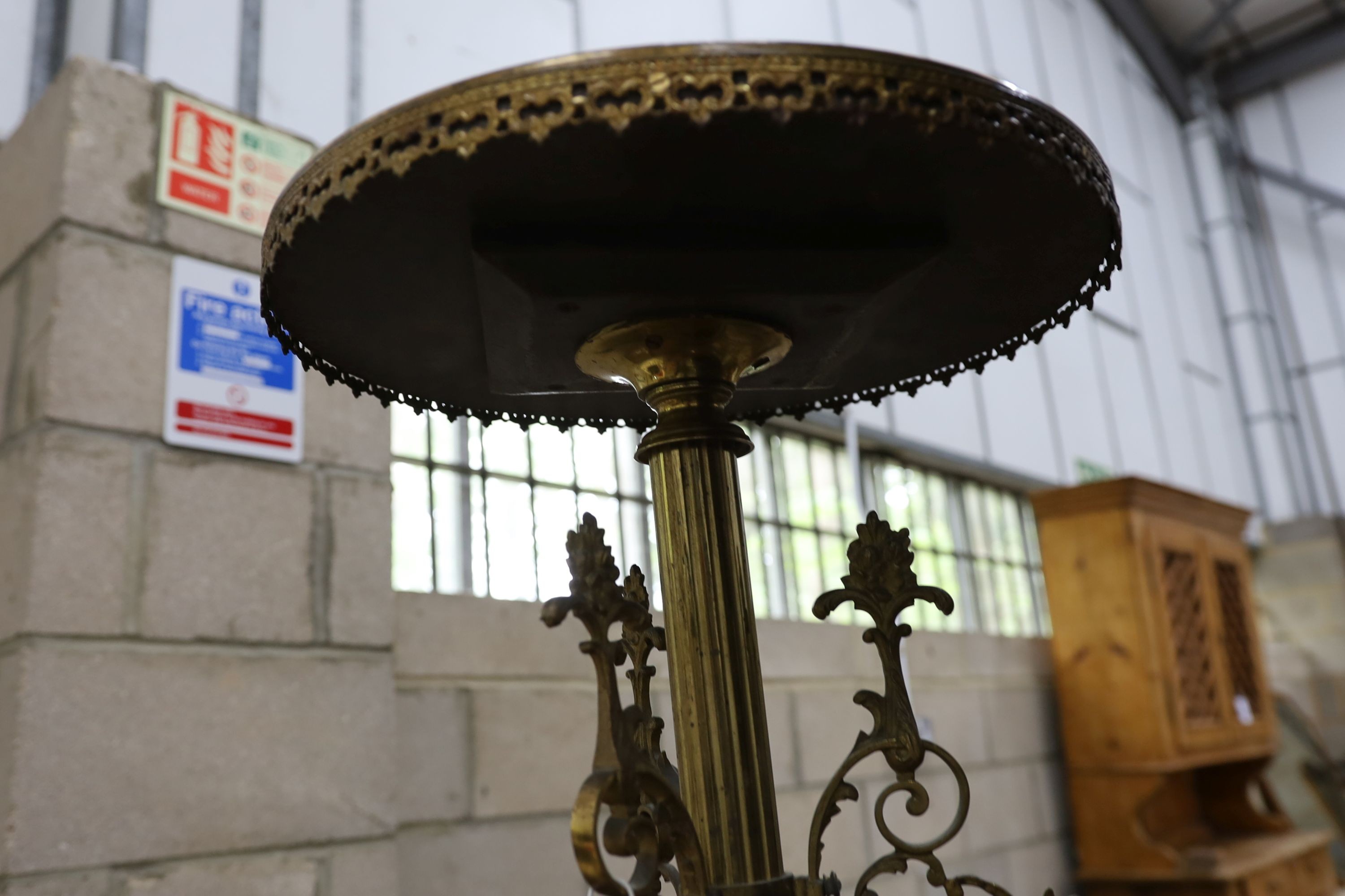 A circular brass and specimen marble tripod table, top diameter 40cm, height 71cm